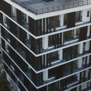 Poupa P190 aluminium louvres installed vertically across a building façade in Nicosia, Cyprus